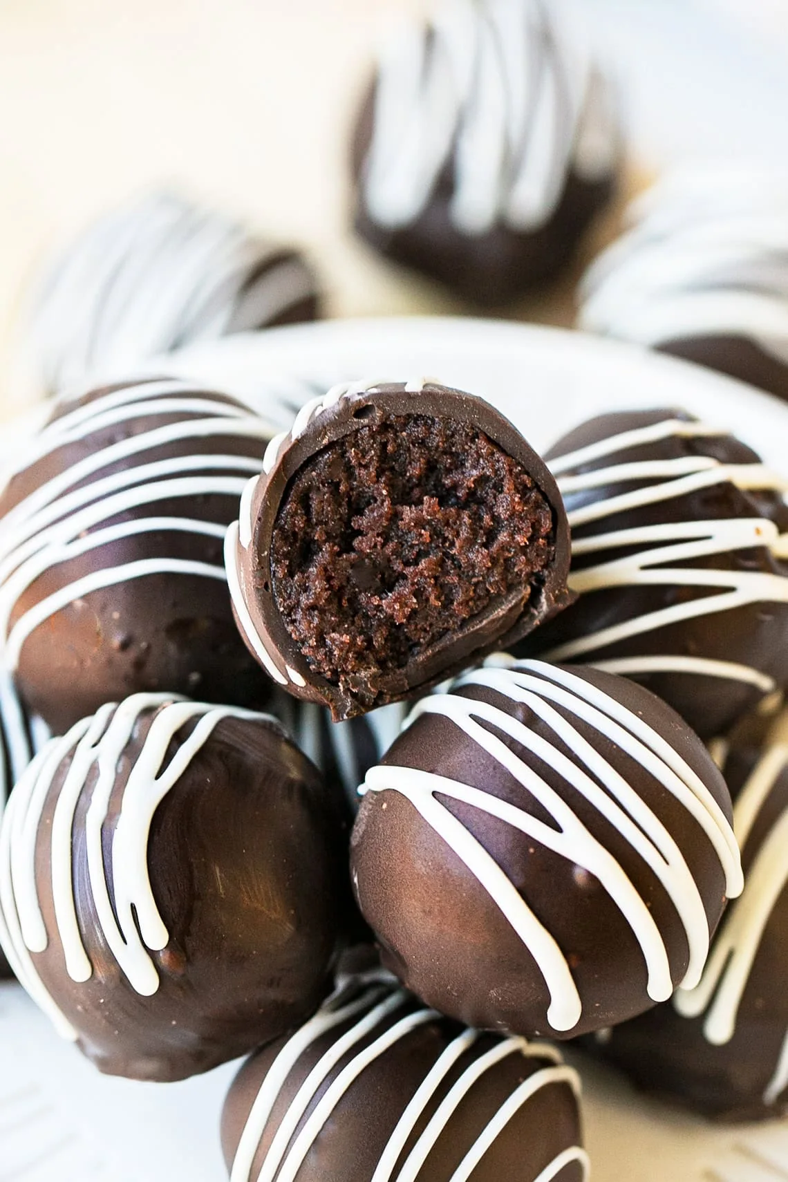 Brownie Fuel Pops with dark chocolate coating and white drizzle