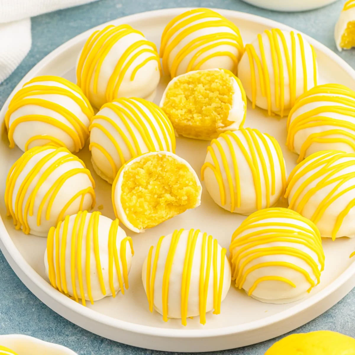 Sunshine Fuel Pops with white coating and yellow lemon drizzle